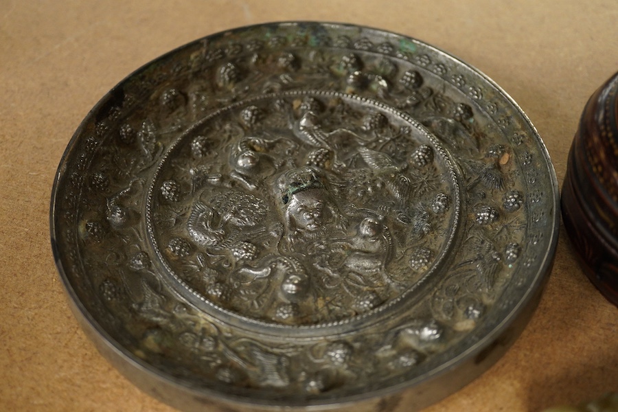 A Chinese silvered bronze mirror, a lacquer box and a jade cylindrical bead, largest 15cm diameter. Condition - fair to good